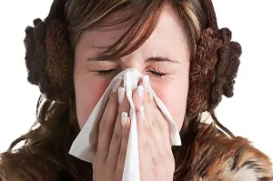 Background White Prints: Pale sick woman with a flu, sneezing, in a white background