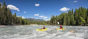 Manly Prints: Panoramic view of two paddlers packrafting scenic river, B.C. Canada