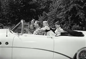 4 5 Years Prints: Parents and their children traveling in a car
