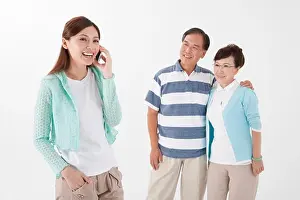 Senior Women Prints: Parents standing together with daughter on the phone