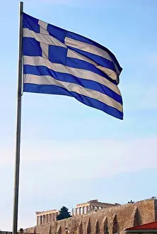 Athens Prints: The Parthenon viewed from below with Greek Flag, Athens, Greece
