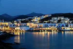Fishing Village Prints: Patios and restaurants at the edge of the water in Naousa on Paros, Greece