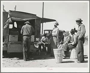 Pea pickers stop for a soft drink