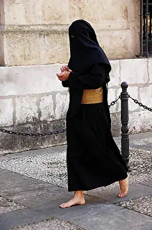 Gown Prints: Penitent dressed in black penitential robe (nazareno) on their way to the Semana Santa