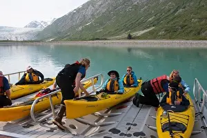 Alaskan Prints: People getting into sea kayaks on loading dock of cruise ship Safari Endeavour near Reid Glacier in Glacier Bay
