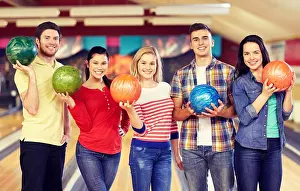 Cheerful Prints: people, leisure, sport, friendship and entertainment concept - happy friends in bowling club