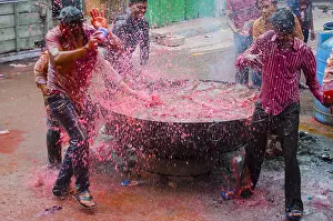 Occasion Prints: People pouring water with colour in Holi festival Jodhpur at Rajasthan India Copyright: xShivjixJoshi/DinodiaxPhotox
