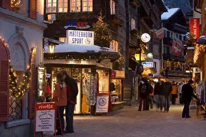 Holidays Prints: People walking over the illuminated shopping street Bahnhofstrasse in the evening