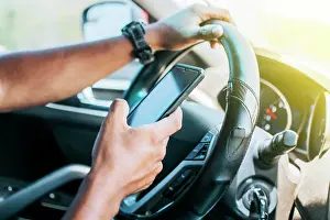 Smart Prints: Person in his car using cell phone