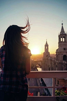 Lighted Prints: Peru, Arequipa, woman looking at Plaza de Armas enjoying sunset
