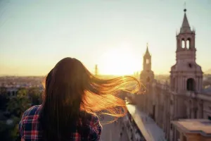 Lighted Prints: Peru, Arequipa, woman looking at Plaza de Armas enjoying sunset