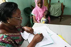 Woman Patient Prints: Photo essay in Lomé, Togo. Medical center for HIV patients. Medical consultation