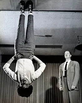 Boots Prints: Photograph depicting Nancy Wendler demonstrating zero gravity shoes for their developer