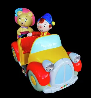 Originally Prints: Photograph of a Noddy car. Noddy is a fictional character created by English children's author Enid Blyton