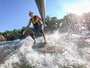 Life Jacket Prints: Photographer Skip Brown stand up paddle surfs challenging whitewater below Great Falls of the Potomac River