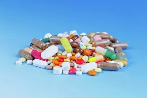 Large Group Prints: Pile of pills against a blue background