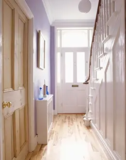 Flooring Prints: Pine doors and laminate wood flooring in pale mauve hall