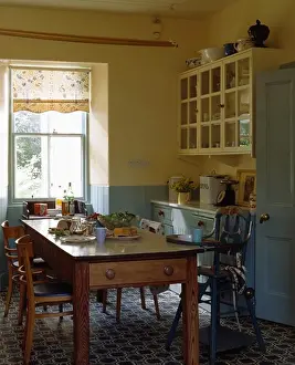 Dining Rooms Prints: Pine table and chairs in cream and blue traditional kitchen with patterned flooring