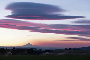 Cascade Prints: Pink hues are reflected of the clouds over Mount Jefferson Oregon