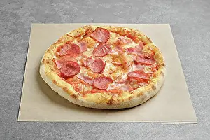 Cheese Prints: Pizza with sausage and pork ham on parchment paper