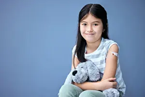 Teddy Bear Prints: Plaster, portrait and girl child with teddy bear for comfort in studio isolated on blue background