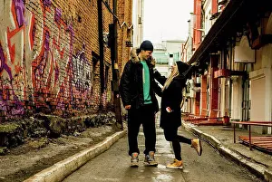Chic Prints: Playful couple in urban alley