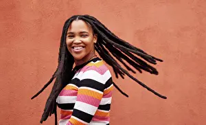 Joke Prints: Playful, fun and portrait of a black woman with a smile isolated on a studio background