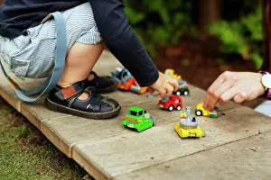 Quality Time Prints: Playtime in the backyard with colorful toy cars