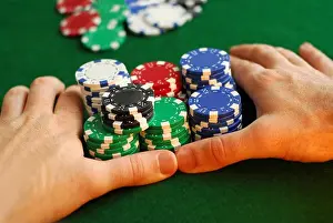Cards Prints: Poker player going all in pushing his chips forward