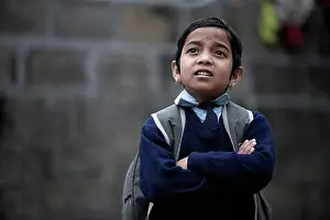 Nepal Prints: Pokhara, Nepal; Orphaned boy in school uniform