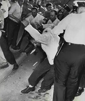 Activist Prints: Police Charge Pickets -- Police are shown charging scattering pickets when fighting broke out at the Univis Lens plant