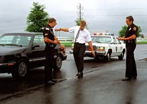 Social Issues Prints: Police Officers Testing A Drunk Driver