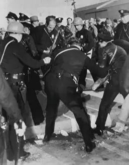 Activist Prints: Police Use Night Sticks on Pickets -- Police officers wield night sticks on pickets at Republic Studio today to open a