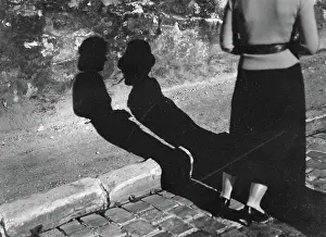 Report Prints: Poll photo collection. Report Paris. Shadows on the sidewalk. 1935. France, Paris