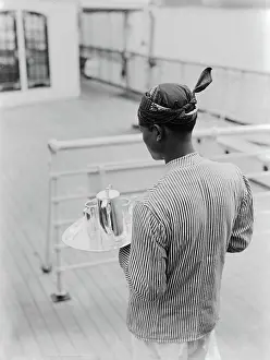 Ships Prints: Poll photo collection. Ships. Javanese servant on the MS Huygens. 1933
