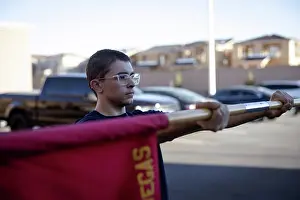 Physical Fitness Prints: A poolee with Recruiting Substation North Las Vegas holds out a guidon before conducting physical training at a pool