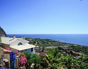 Outlook Prints: The port town of Valle Gran Rey on the Canary Island of Gomera in the midday sun