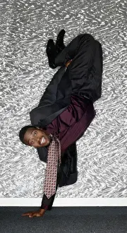 Handstand Prints: Portrait of African man performing handstand