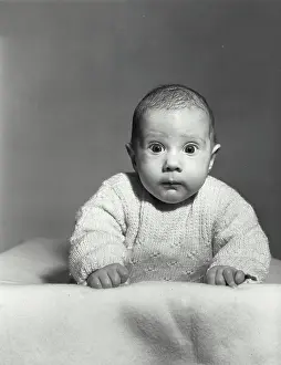 Curiosity Prints: Portrait of a baby looking surprised