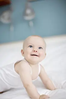 Portrait of a baby lying in a bed, Sweden