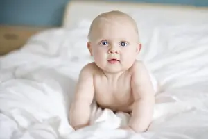 Thoughtful Prints: Portrait of a baby lying in a bed, Sweden