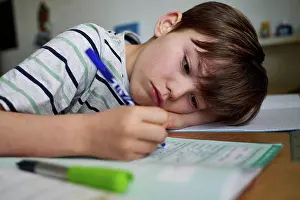 Home Prints: Portrait of boy doing homework