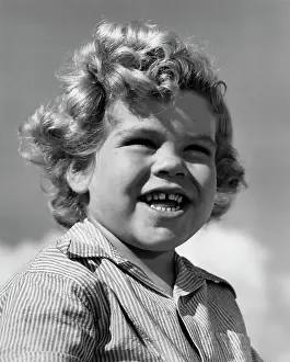 Adolescence Prints: Portrait of boy smiling, outdoors