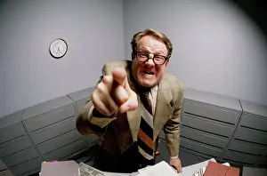 Business Suit Prints: Portrait of a businessman pointing forward in anger