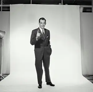 Business Suit Prints: Portrait of businessman pointing upwards