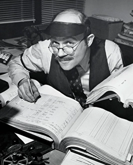 Bald Prints: Portrait of a businessman working on accounting ledgers