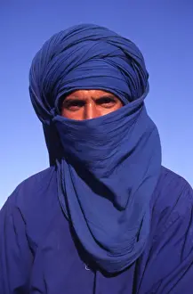 Arabic Prints: Portrait of a camel rider standing in the desert, Tunisia, North Africa