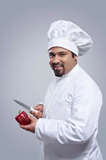Chef Prints: Portrait of chef with capsicum and knife