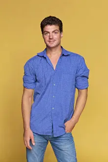 Jeans Prints: Portrait confident man in blue on yellow background
