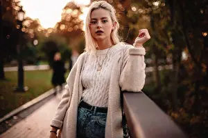 Sweater Prints: Portrait of confident young woman standing in park during autumn